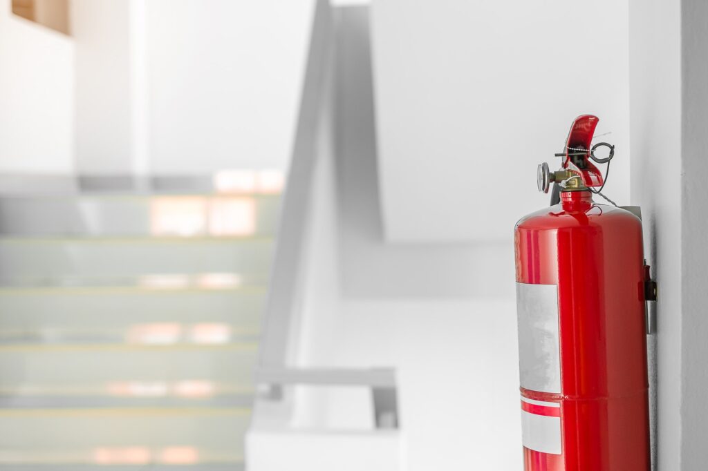 Fire extinguisher system on the wall background,